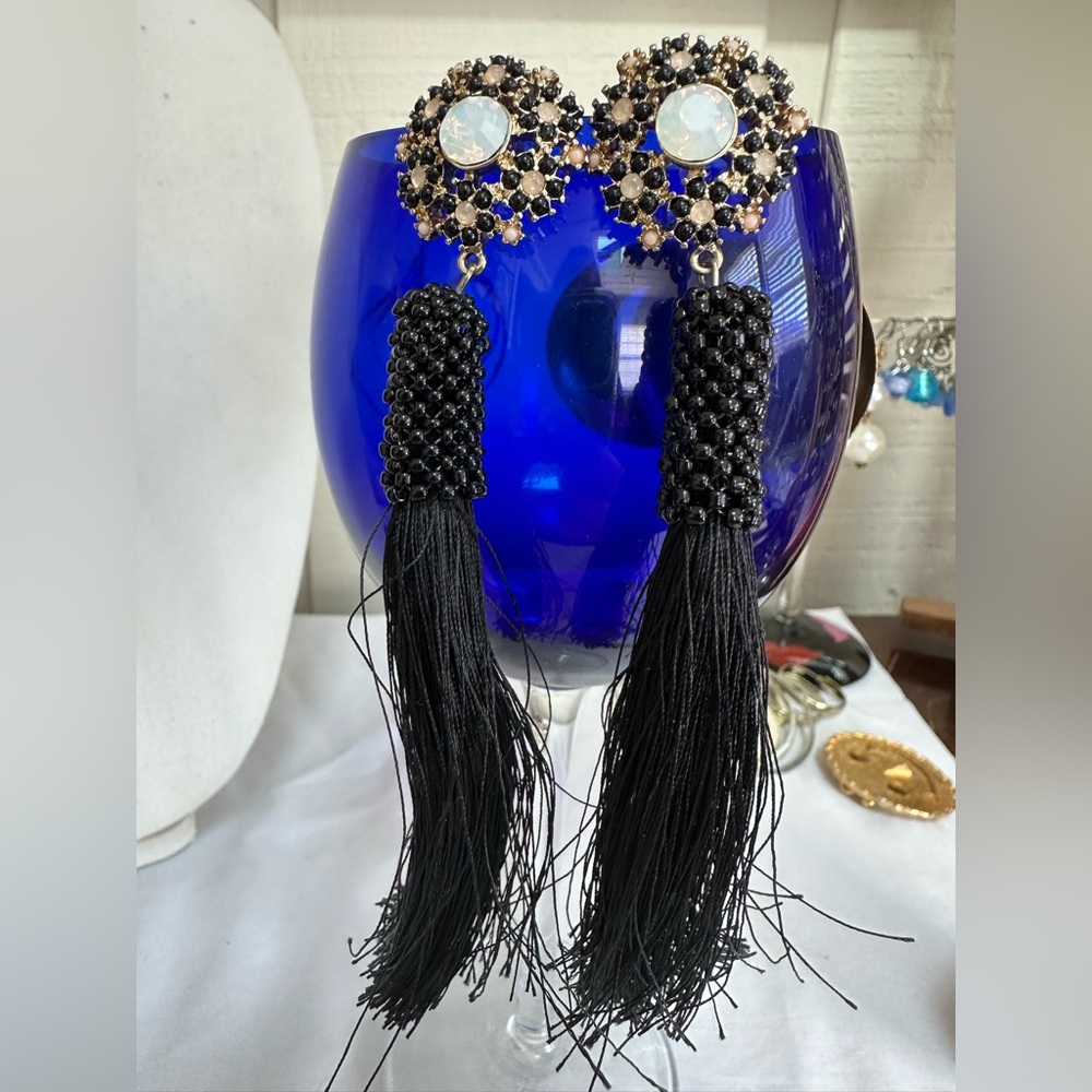 Long black tassel earrings with beaded accent area